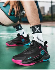 Detailed view of black basketball shoes with swivel buckle and vibrant pink accents