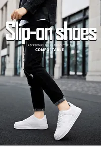 Close-up of classic white low-top casual sneakers on an urban street background