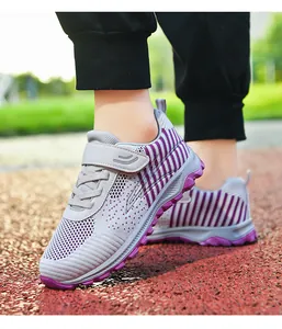 Close-up of breathable mesh walking shoes with purple stripes and non-slip soles