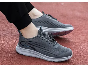 Detailed macro view of breathable grey mesh walking shoes on an athletic track.
