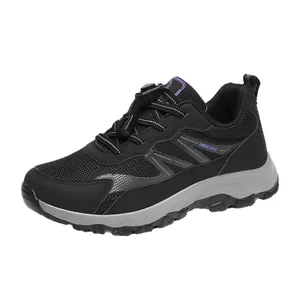 Lightweight black mesh athletic walking shoe with durable gray sole for outdoor travel