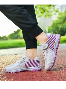 Detailed view of breathable grey mesh walking shoes with purple stripes and velcro strap