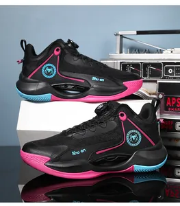 Detail of black basketball shoes with rotary buckle and pink accents on mesh surface