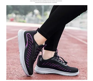 Breathable black and purple mesh walking shoes with lightweight EVA sole on running track