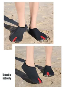 Close-up view of breathable black mesh split-toe water shoes for beach and yoga activities
