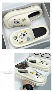Fashionable cream platform EVA clogs featuring cute astronaut charms and thick soles for comfort