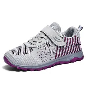 Grey breathable mesh walking shoes with purple accents and velcro strap for seniors