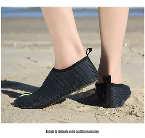 Quick-dry mesh water shoes for beach and swimming, shown being worn on sand