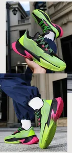 Detailed outdoor shot showing neon green and black low-top basketball training shoes
