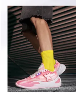 Detailed shot of pink low-top basketball sneakers featuring butterfly wing logo