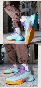 Detail view of colorful low-top basketball shoes with gradient sole and mint green upper.