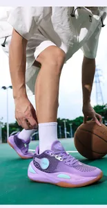 Macro view of purple mesh basketball shoes worn by an athlete on an outdoor court