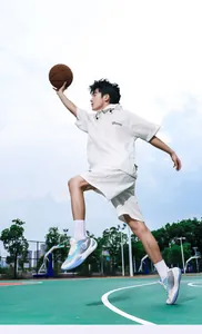 Dynamic action shot of blue gradient basketball shoes on an outdoor court