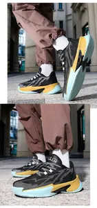 Close-up of stylish low-top basketball shoes featuring a mesh upper and color-blocked sole