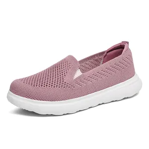 Comfortable pink breathable flyknit mesh slip-on walking sneakers with thick white sole