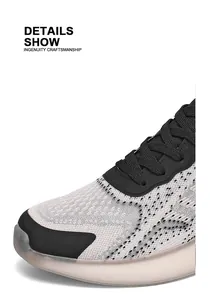 Detailed close-up of men's breathable mesh running shoe with popcorn cushion sole.