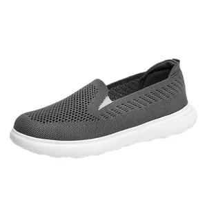 Breathable grey fly-knit mesh slip-on walking shoes with lightweight white soles