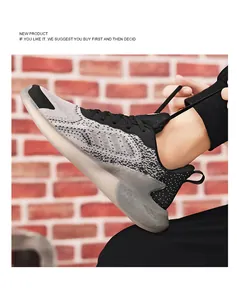 Close-up of men's breathable mesh running shoes with thick translucent cushioned sole.