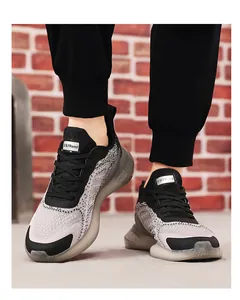 Close-up of men's breathable grey and black mesh running sneakers with thick cushioning soles