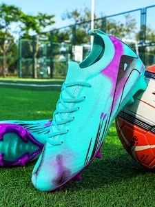 Professional turquoise low-top soccer shoes with purple studs for outdoor field matches