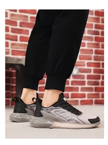 Detailed side view of breathable mesh running shoe with thick cushioning sole