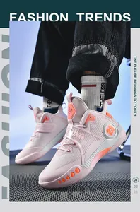 Baskets de basketball roses montantes avec tige en mesh et bride velcro stylée.