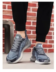 Detailed view of gray mesh running shoes with cushioning translucent soles