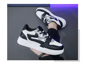 Vista detallada de las elegantes zapatillas de skate de cuero retro para hombre en blanco.