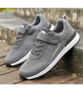 Detail view of gray flyknit walking shoes with breathable mesh and velcro strap closure