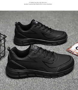Detail showing the matte black faux leather surface of the men's athletic running shoe.
