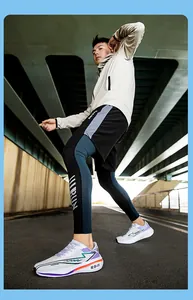 Detail of white breathable mesh running shoes worn by a male athlete in urban setting