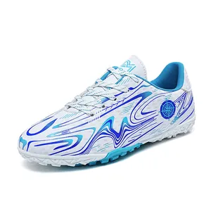 White turf soccer shoes featuring blue wave patterns for children and adult training