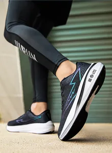 Detail of breathable black mesh running shoes featuring gradient lightning bolt patterns