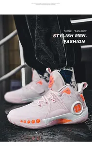 Vue détaillée de chaussures de basket en mesh rose et orange avec fermeture à velcro