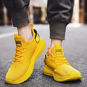 Breathable men's fly-knit running shoes in vibrant yellow with modern street style design