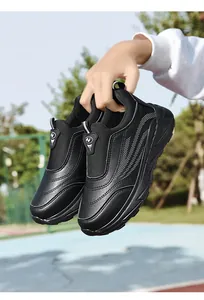 Close-up view of black slip-on walking shoes for seniors with a durable leather finish.