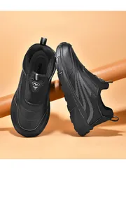 Close-up of black leather slip-on walking shoes for seniors with wave pattern detail.