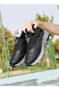 Black slip-on walking shoes with leather upper and thick white soles for adults