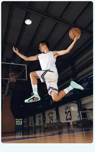 Professional action shot of mint green low-top mesh basketball shoes on a court