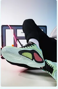 Detailed view of mint green low-top basketball shoes featuring breathable mesh and non-slip sole
