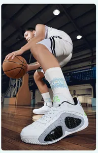 Detailed view of white breathable basketball shoes with a unique speckled midsole pattern