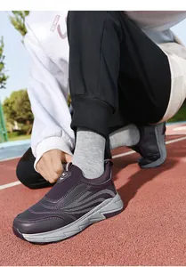 Detailed view of purple senior slip-on sports shoes with comfortable grey soles
