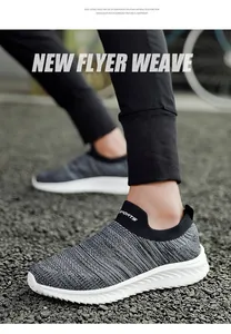 Close-up of breathable grey flyknit slip-on sneakers with lightweight white EVA sole