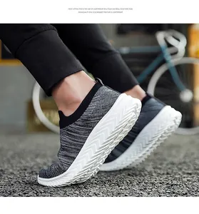 Low-top breathable knit sock shoes with white EVA foam sole for outdoor sports.
