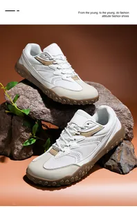 Primer plano detallado de zapatillas de entrenamiento para exteriores en blanco y marrón