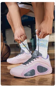 Close-up of pink low-top basketball shoe design with breathable mesh and sturdy sole