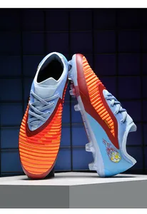 Close-up detail of colorful soccer cleats with breathable woven fabric and firm studs