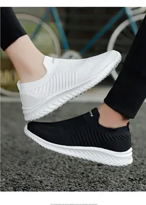 Detail of breathable flyknit slip-on sneakers shown in black and white color variants