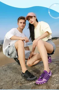 Outdoor breathable mesh barefoot water shoes for men and women on a rocky sunny beach