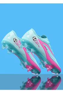 Detailed view of light blue and pink soccer cleats featuring knitted upper and FG studs.